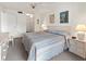 Spacious main bedroom with king-size bed and private balcony at 1801 Gulf N Dr # 222, Bradenton Beach, FL 34217