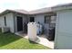 Back patio with water filtration system and large trash bin at 1820 E Leewynn Dr, Sarasota, FL 34240