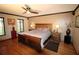 Main bedroom with hardwood floors and large windows at 1820 E Leewynn Dr, Sarasota, FL 34240