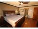 Main bedroom with hardwood floors and ensuite bathroom access at 1820 E Leewynn Dr, Sarasota, FL 34240