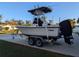 White Mako fishing boat on trailer with T-top and outbard motor cover at 1820 E Leewynn Dr, Sarasota, FL 34240