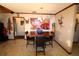 Spacious dining area with a wood table, leather chairs, and eclectic wall decor at 1820 E Leewynn Dr, Sarasota, FL 34240