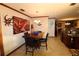 Bright dining room features a wood table with leather chairs and unique wall art at 1820 E Leewynn Dr, Sarasota, FL 34240