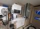 Garage with HVAC unit, cabinets and stereo at 1820 E Leewynn Dr, Sarasota, FL 34240
