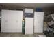 Garage with additional storage cabinets and a refrigerator at 1820 E Leewynn Dr, Sarasota, FL 34240