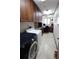 Laundry room with washer, dryer, and built-in cabinets at 1820 E Leewynn Dr, Sarasota, FL 34240