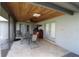 Spacious screened patio with outdoor dining furniture at 1820 E Leewynn Dr, Sarasota, FL 34240