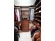 Spacious walk-in closet offering custom shelving and hanging space at 1820 E Leewynn Dr, Sarasota, FL 34240