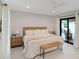 Spacious bedroom with a king bed and access to the patio at 1899 Buccaneer Cir, Sarasota, FL 34231