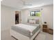 Bright bedroom with a queen-size bed and a walk-in closet at 1899 Buccaneer Cir, Sarasota, FL 34231