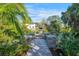 Private boat dock with lush landscaping and paved walkway at 1899 Buccaneer Cir, Sarasota, FL 34231