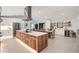 Open concept kitchen with an expansive island, stainless steel appliances, and ample counter space at 1899 Buccaneer Cir, Sarasota, FL 34231