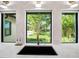 Kitchen sink with modern faucet and three windows overlooking a lush green lawn at 1899 Buccaneer Cir, Sarasota, FL 34231