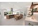 Open concept kitchen with large island, dining area, and stainless steel appliances at 1899 Buccaneer Cir, Sarasota, FL 34231