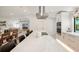 Open concept kitchen with large island, breakfast bar, and view to living room at 1899 Buccaneer Cir, Sarasota, FL 34231