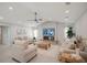 Light and airy living room with comfortable sofas and a fireplace at 1899 Buccaneer Cir, Sarasota, FL 34231