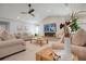 Bright living room with a fireplace and comfortable seating at 1899 Buccaneer Cir, Sarasota, FL 34231