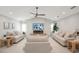 Spacious living area featuring a fireplace and large TV at 1899 Buccaneer Cir, Sarasota, FL 34231