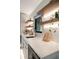 Modern wet bar with floating shelves, wine cooler, and quartz countertop at 1899 Buccaneer Cir, Sarasota, FL 34231