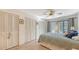 Bedroom with ample closet space, light flooring, and access to a balcony at 304 Spring Lakes Blvd # 304, Bradenton, FL 34210