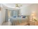 Bedroom with a queen-size bed and access to a private balcony at 304 Spring Lakes Blvd # 304, Bradenton, FL 34210