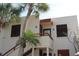 Condo building showcasing architectural details and palm trees at 304 Spring Lakes Blvd # 304, Bradenton, FL 34210