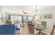Spacious living room with seating area and access to a screened-in patio at 304 Spring Lakes Blvd # 304, Bradenton, FL 34210