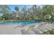 Community pool with lounge chairs and plenty of space to relax at 304 Spring Lakes Blvd # 304, Bradenton, FL 34210