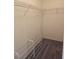 Walk-in closet with wire shelving and shoe rack at 3404 Overcup Oak Ter, Sarasota, FL 34237