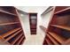 Large walk-in closet with ample shelving and hanging space at 4028 Mira Lago Dr, Sarasota, FL 34238