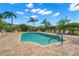 Inviting community pool with lounge chairs and patio area at 4028 Mira Lago Dr, Sarasota, FL 34238