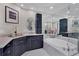 Elegant bathroom featuring a soaking tub and double vanity at 415 L Ambiance Dr # C403, Longboat Key, FL 34228