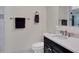 Well-appointed bathroom with dark vanity and white countertop at 415 L Ambiance Dr # C403, Longboat Key, FL 34228