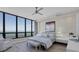 Bright bedroom with ocean views, large bed, and built-in nightstands at 415 L Ambiance Dr # C403, Longboat Key, FL 34228