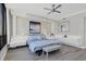 Serene bedroom with ocean views, a large bed, and built-in nightstands at 415 L Ambiance Dr # C403, Longboat Key, FL 34228