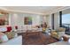 Bright living room with large sectional sofa and ocean view at 415 L Ambiance Dr # C403, Longboat Key, FL 34228