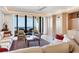Living room with ocean view and comfortable seating at 415 L Ambiance Dr # C403, Longboat Key, FL 34228