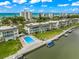 Aerial view of waterfront community with pool and canal access at 4360 Chatham Dr # 108, Longboat Key, FL 34228