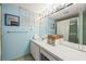 Clean bathroom with light blue walls and updated vanity at 4360 Chatham Dr # 108, Longboat Key, FL 34228