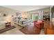 Bright bedroom with a comfy bed, and access to a patio at 4360 Chatham Dr # 108, Longboat Key, FL 34228