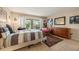 Bedroom with a queen bed, dresser, and patio access at 4360 Chatham Dr # 108, Longboat Key, FL 34228