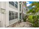 Building exterior with bike and grassy area at 4360 Chatham Dr # 108, Longboat Key, FL 34228