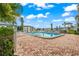 Inviting community pool with lounge chairs at 4360 Chatham Dr # 108, Longboat Key, FL 34228
