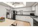 Spacious kitchen with ample counter space and white cabinetry at 4360 Chatham Dr # 108, Longboat Key, FL 34228
