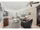 Relaxing living room with leather couches, a coffee table, and a ceiling fan at 4360 Chatham Dr # 108, Longboat Key, FL 34228