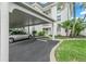 Covered carport with convenient access to building entrance at 4360 Chatham Dr # 108, Longboat Key, FL 34228