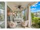 Relaxing sunroom with glass doors, comfortable seating, and water views at 4360 Chatham Dr # 108, Longboat Key, FL 34228