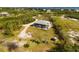 Aerial view of home with playground and waterfront views at 445 Horseshoe Loop Rd, Terra Ceia, FL 34250