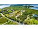Aerial view of a waterfront lot with a pond and access to the bay at 445 Horseshoe Loop Rd, Terra Ceia, FL 34250
