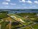 Aerial view of waterfront property with a house and access to the bay at 445 Horseshoe Loop Rd, Terra Ceia, FL 34250
